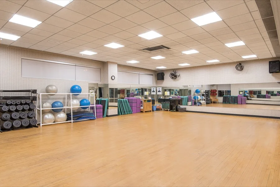Group class studio with mats and exercise balls